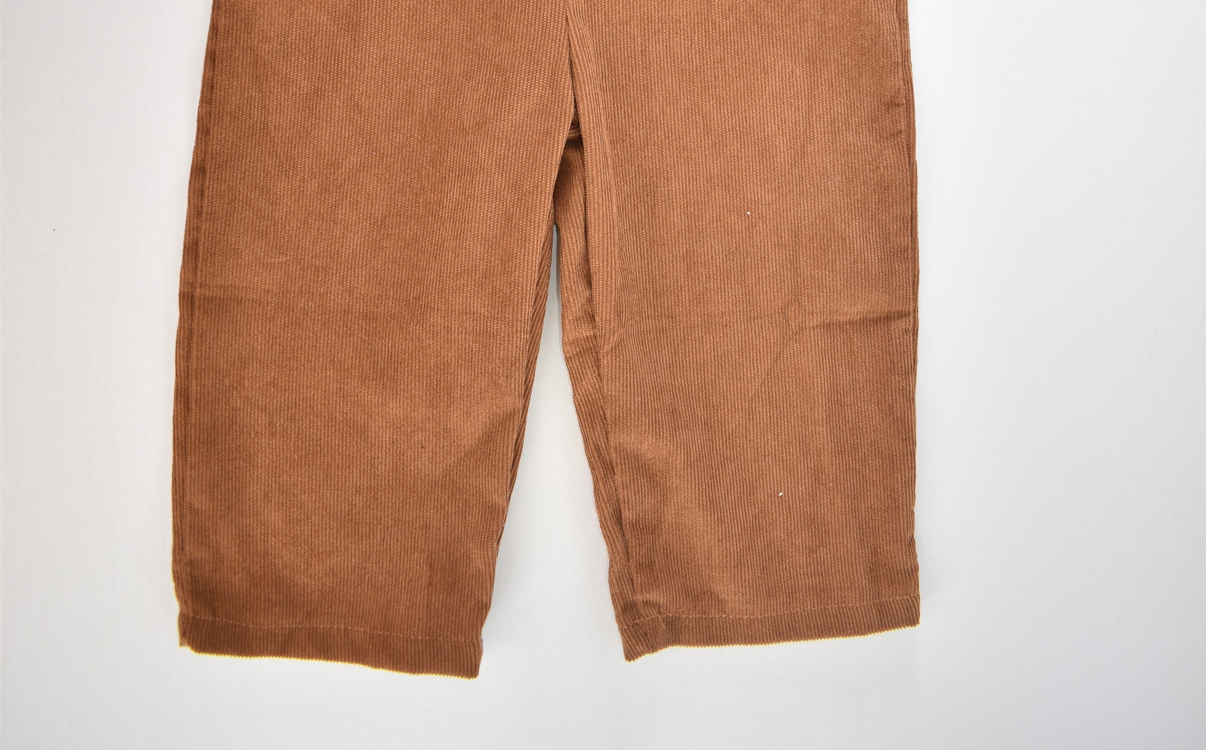 Brown cord dungarees with "ONE" appliqué