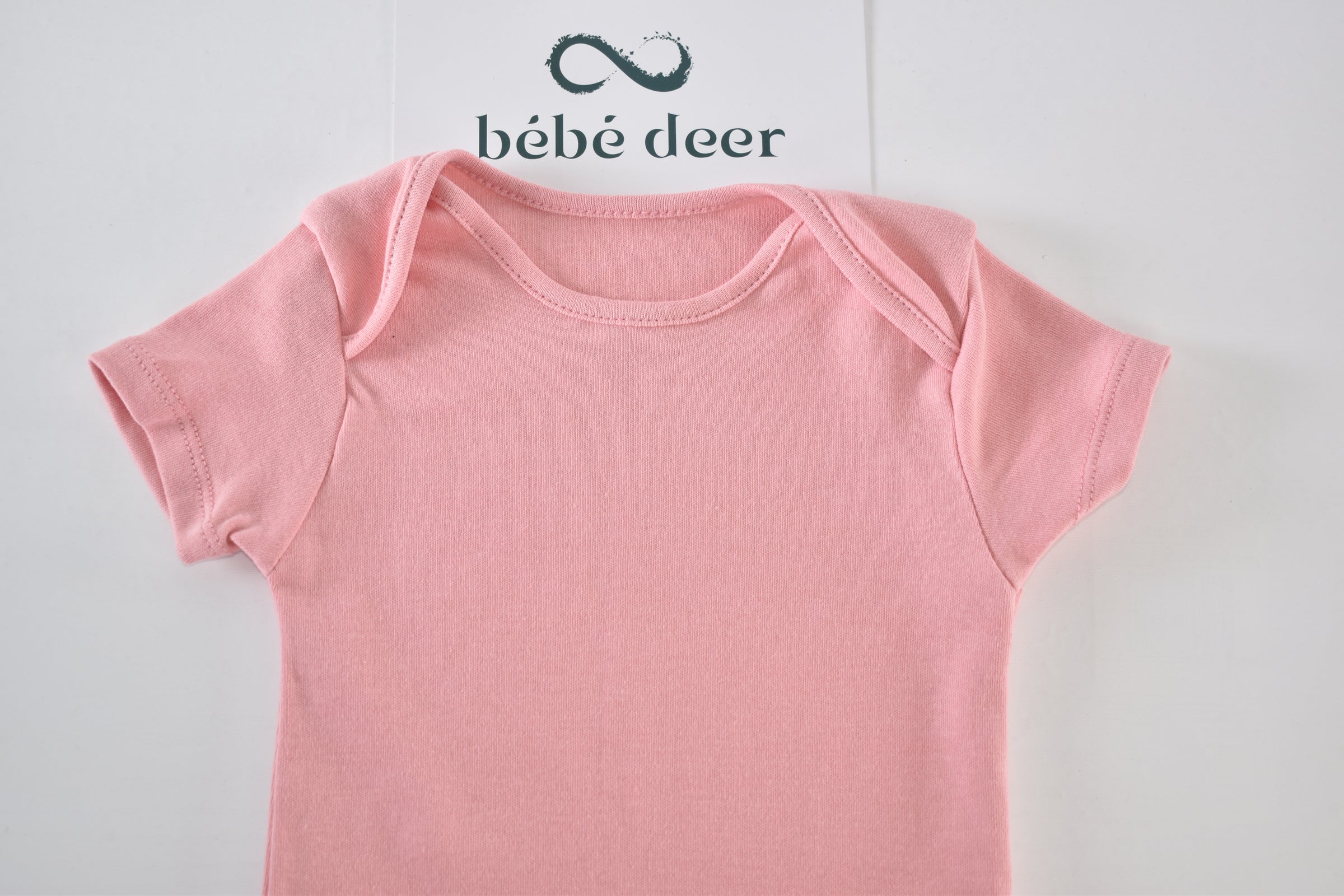 Pink short-sleeved cotton bodysuit