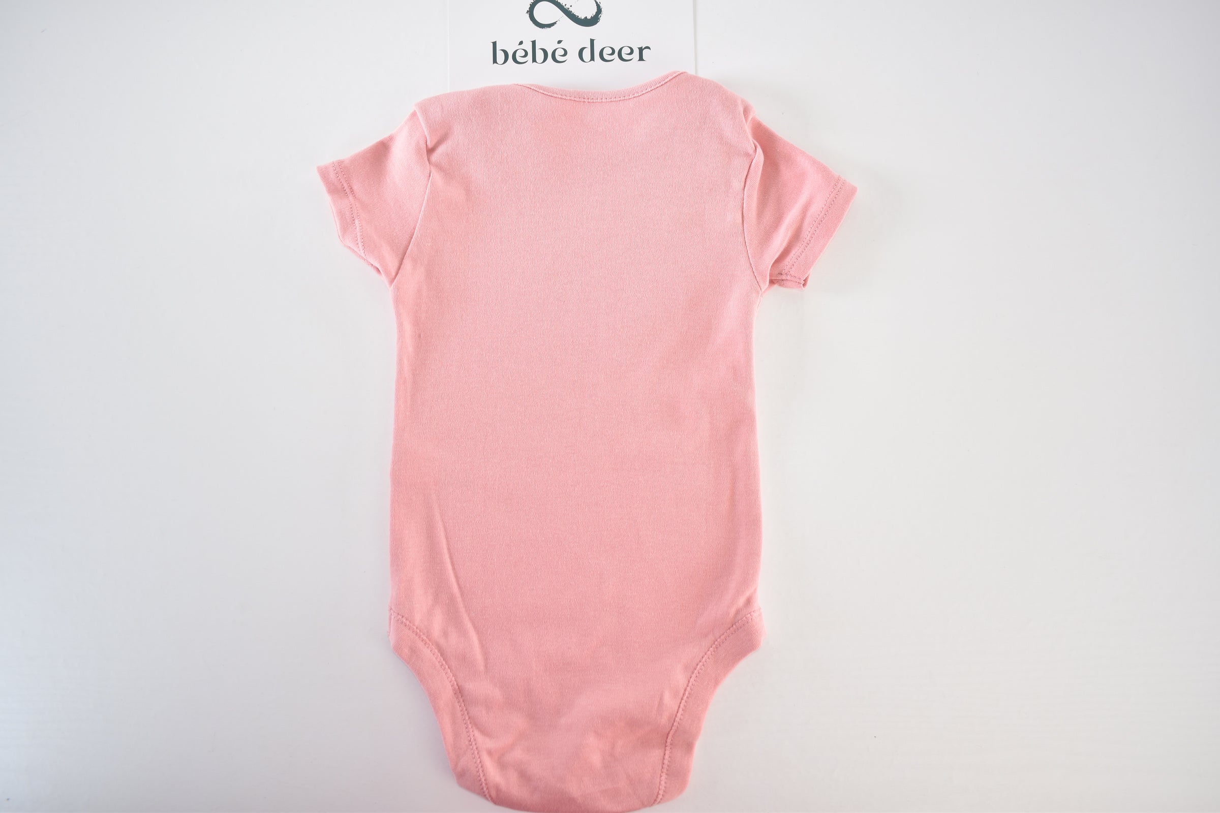 Pink short-sleeved cotton bodysuit