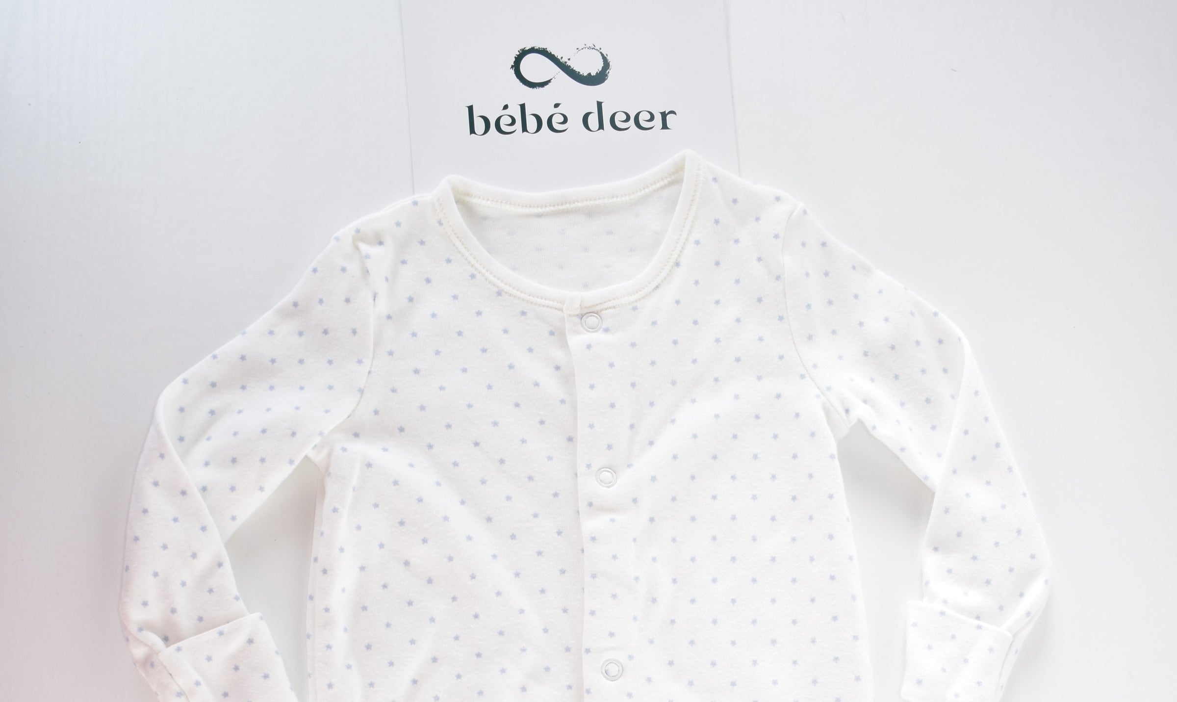 White cotton sleepsuit with blue stars