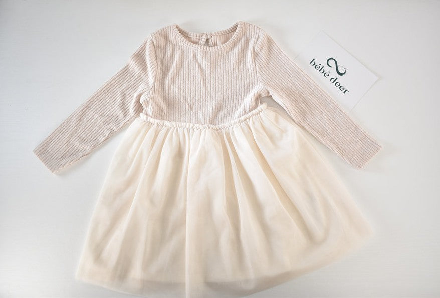 Cream dress with flowing tulle skirt
