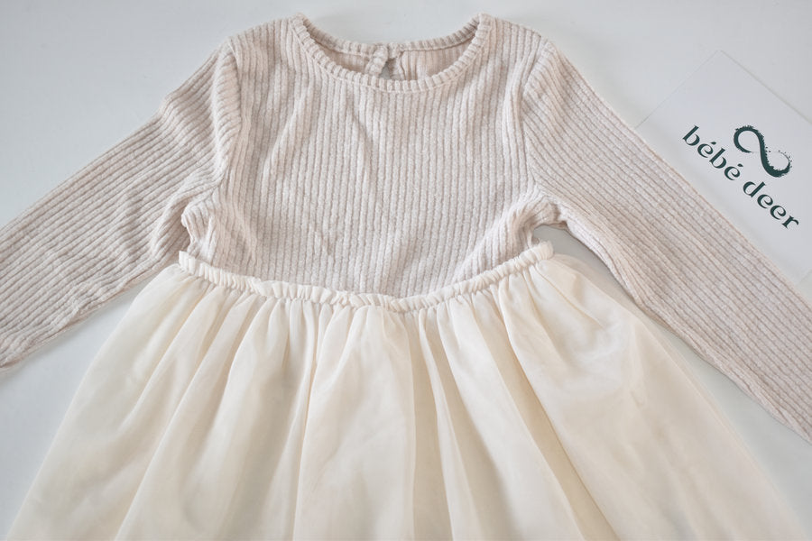 Cream dress with flowing tulle skirt
