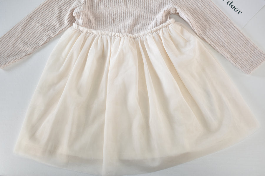 Cream dress with flowing tulle skirt