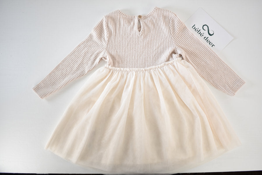 Cream dress with flowing tulle skirt