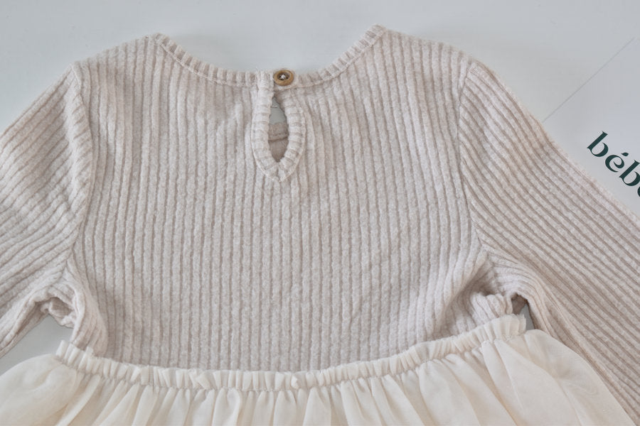 Cream dress with flowing tulle skirt