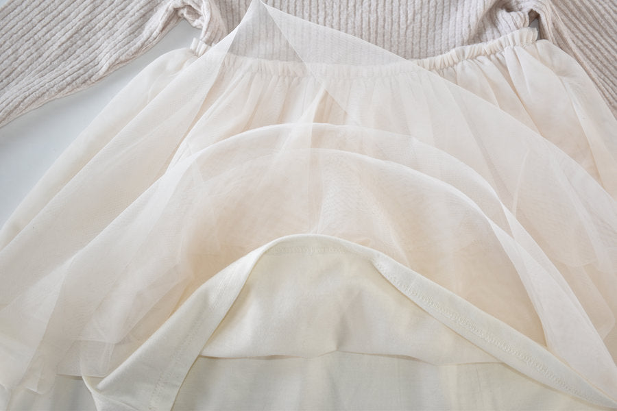Cream dress with flowing tulle skirt