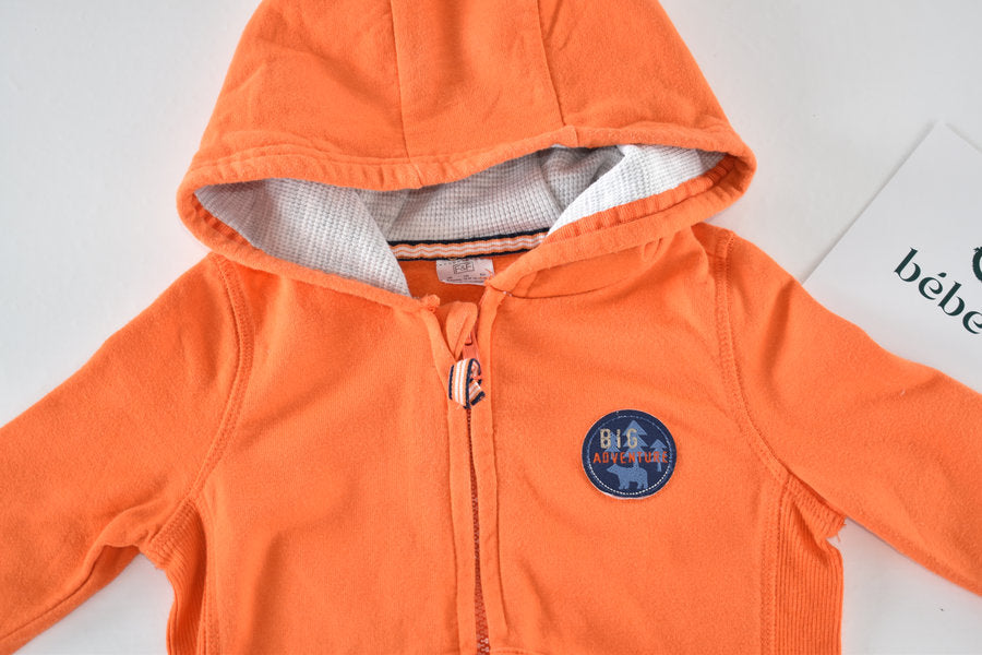 Orange hooded jacket with Big Adventure badge