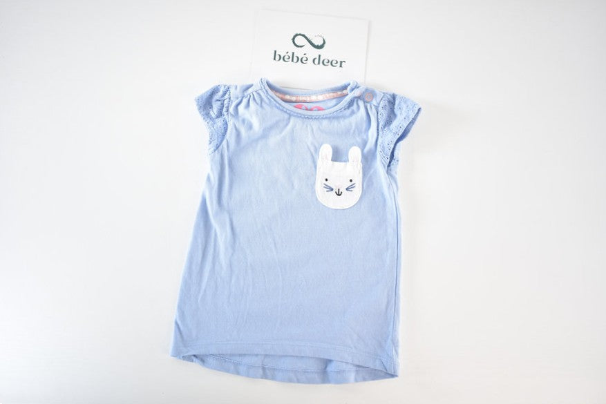 Blue top with bunny pocket detail