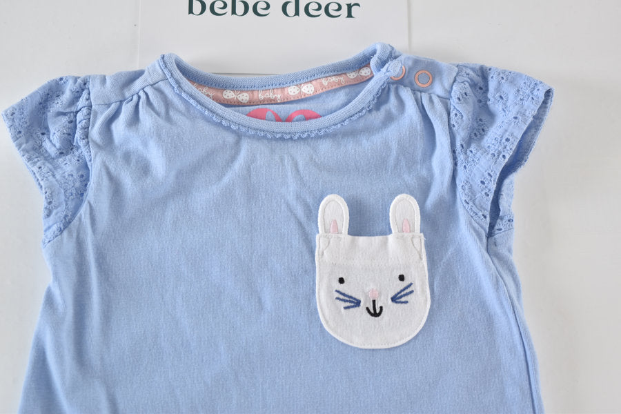 Blue top with bunny pocket detail