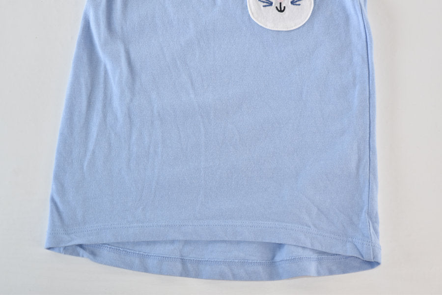 Blue top with bunny pocket detail