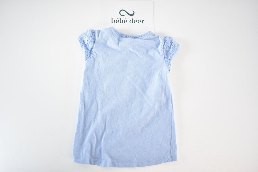 Blue top with bunny pocket detail