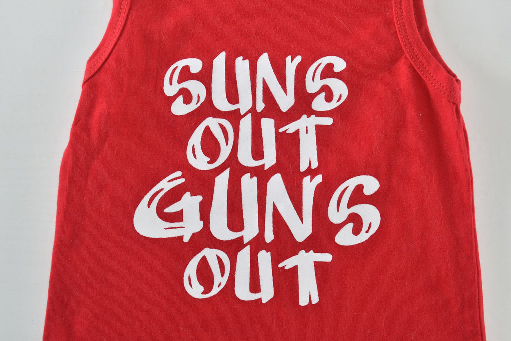 Top  "Suns out guns out"
