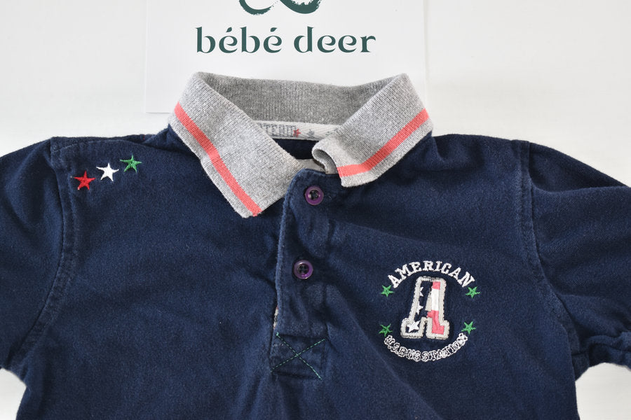 Navy Polo Shirt with Embroidered “American Bus Station”