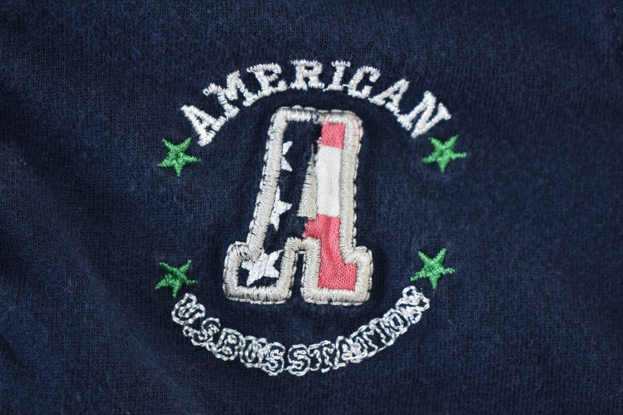 Navy Polo Shirt with Embroidered “American Bus Station”