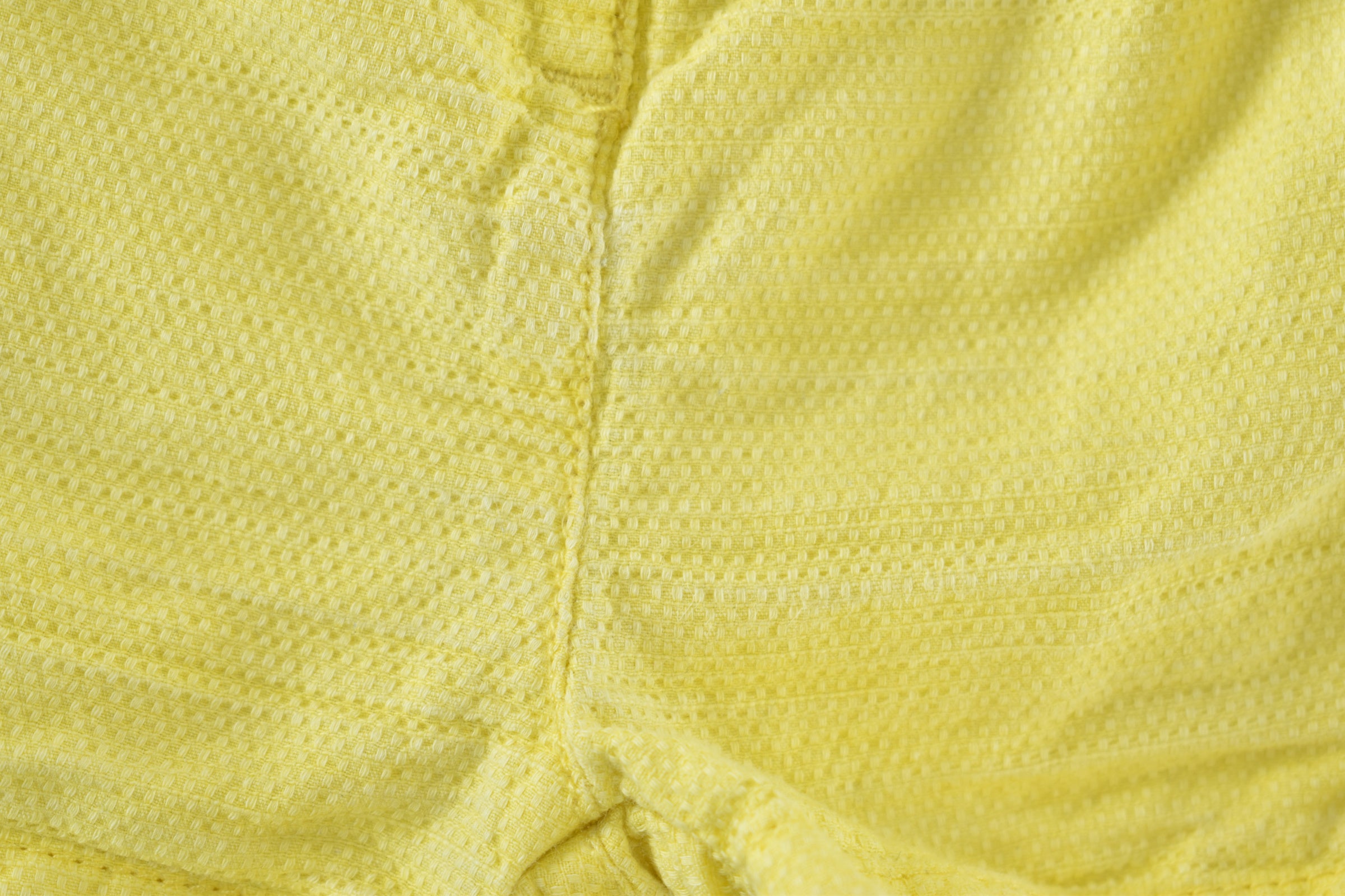 Yellow textured shorts with ruffle details