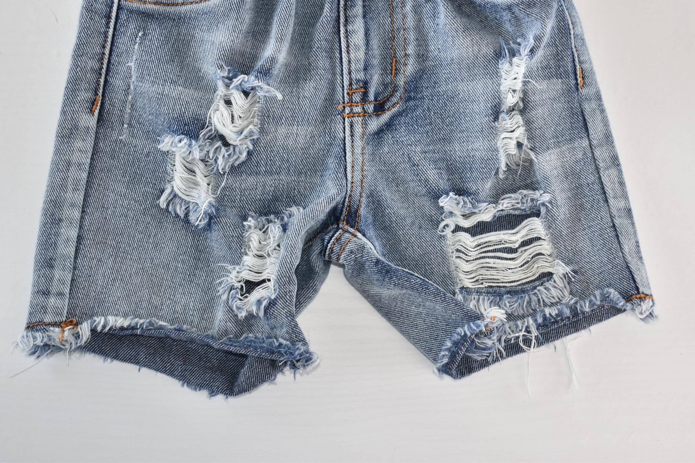 Distressed denim shorts