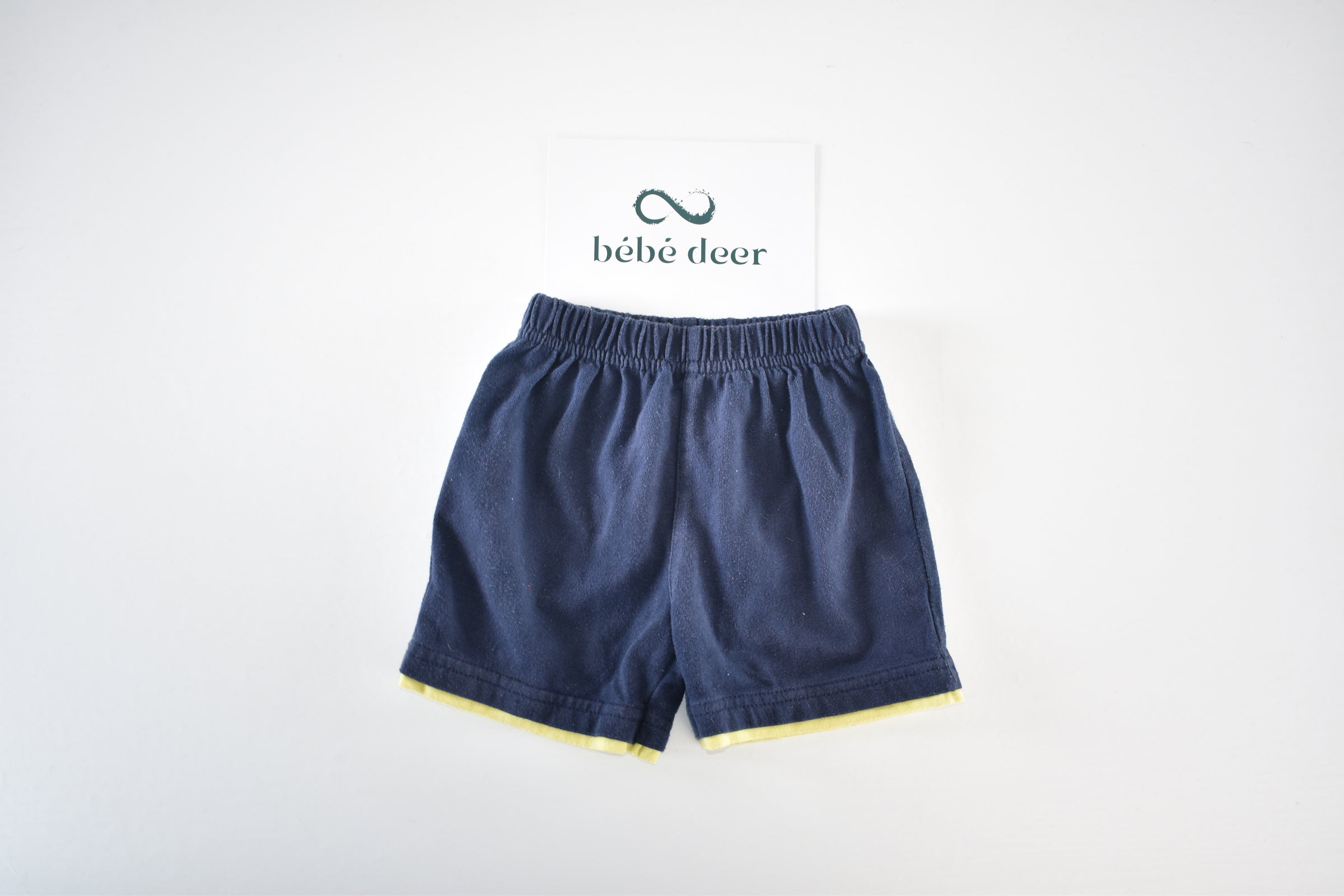 Navy shorts with yellow trim
