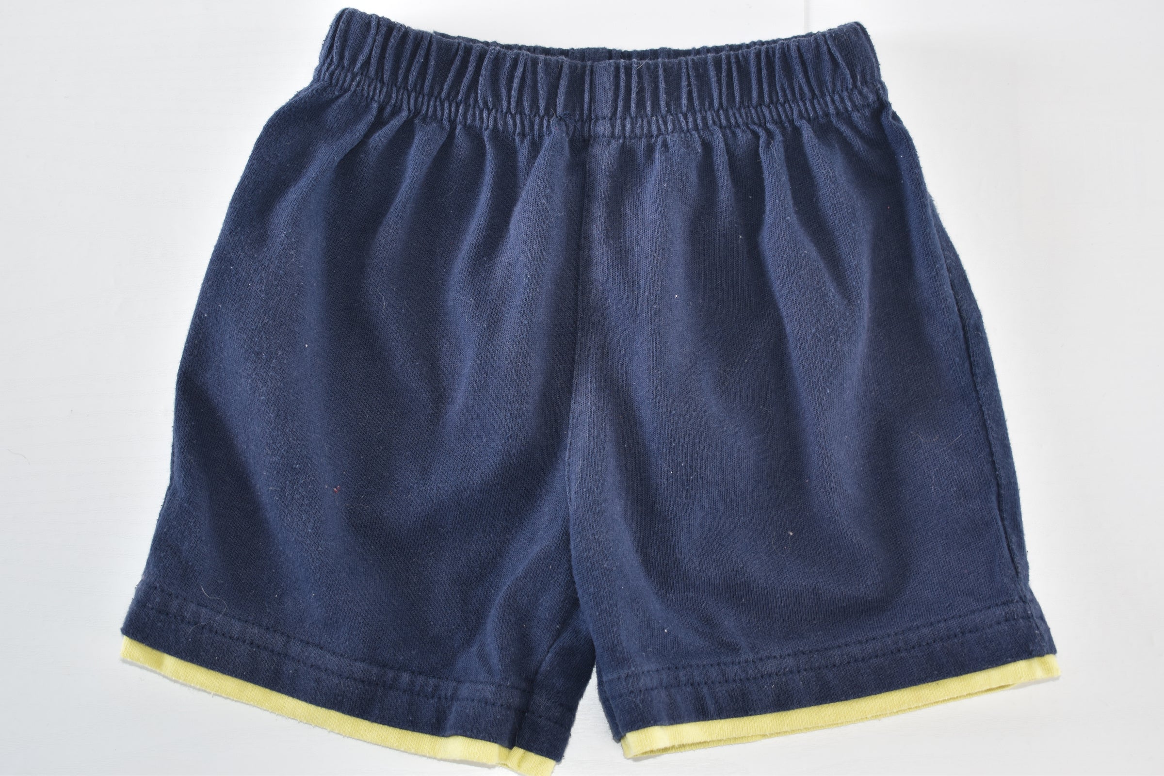 Navy shorts with yellow trim