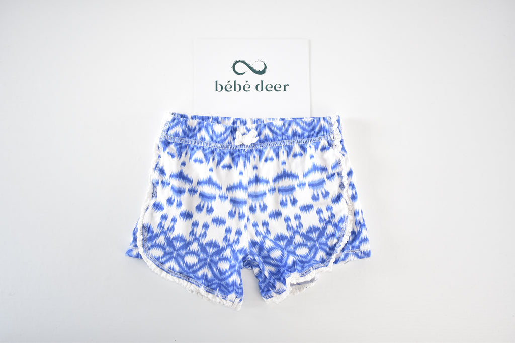 Blue patterned shorts with pom-pom trim
