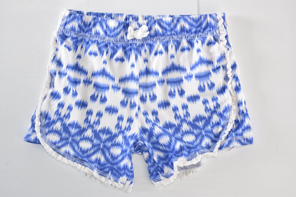 Blue patterned shorts with pom-pom trim