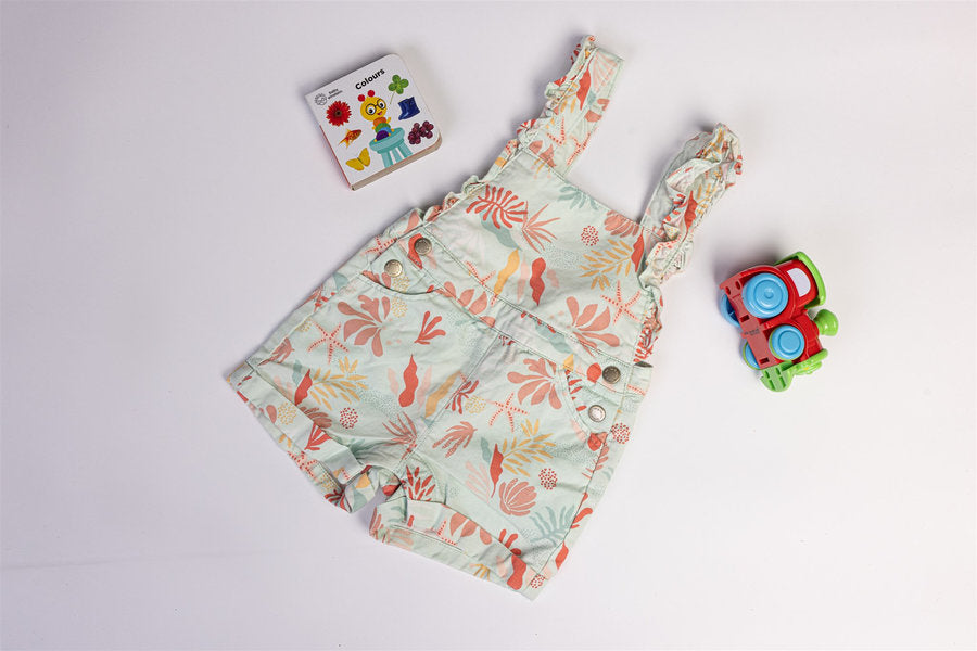 Sleeveless dungaree coral and pastel botanical print