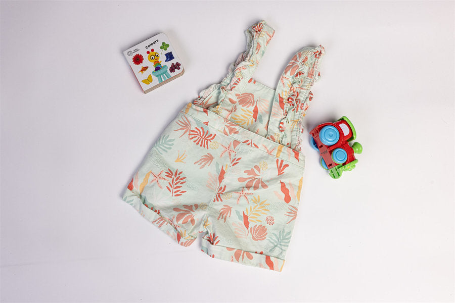 Sleeveless dungaree coral and pastel botanical print