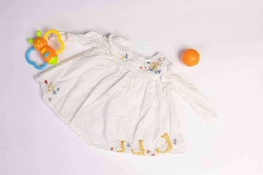 Dress with embroidered floral details