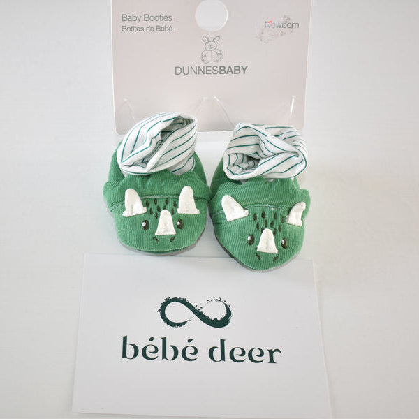 Newborn booties with dinosaur detail