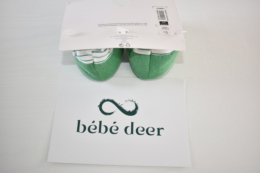 Newborn booties with dinosaur detail