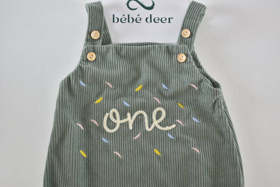 Green velour dungaree romper