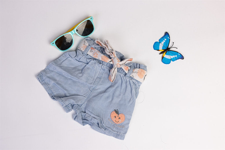 Denim-style shorts with peach motifs