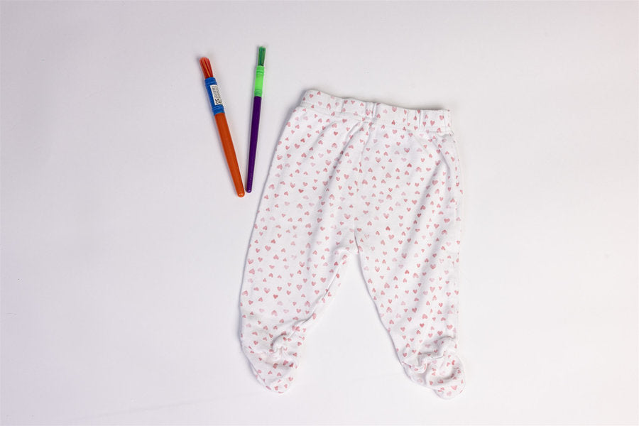 White footed trousers with pink heart
