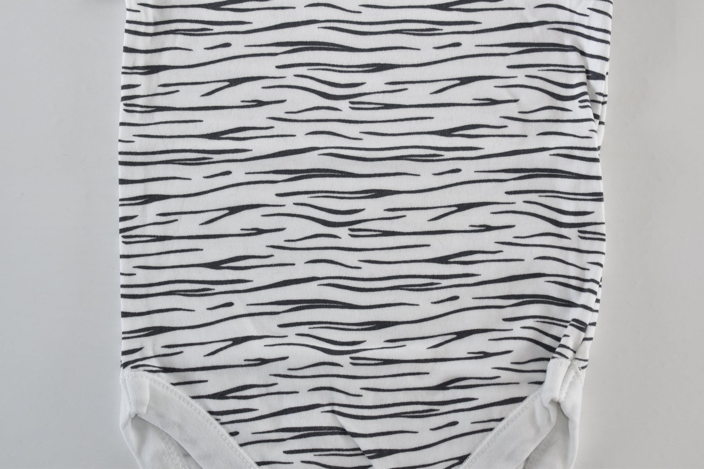 Set of 4 patterned bodysuits