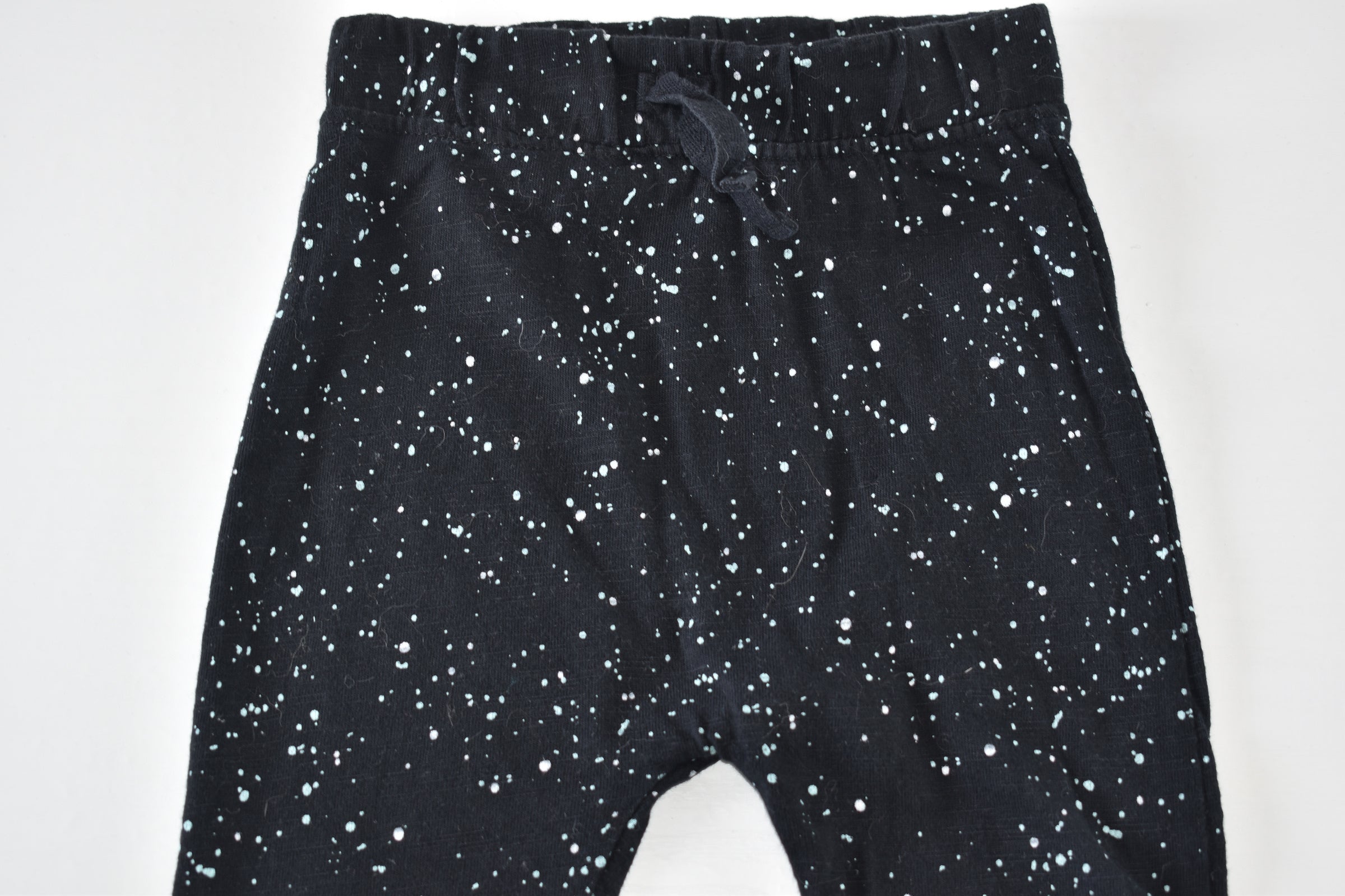 Speckled black trousers