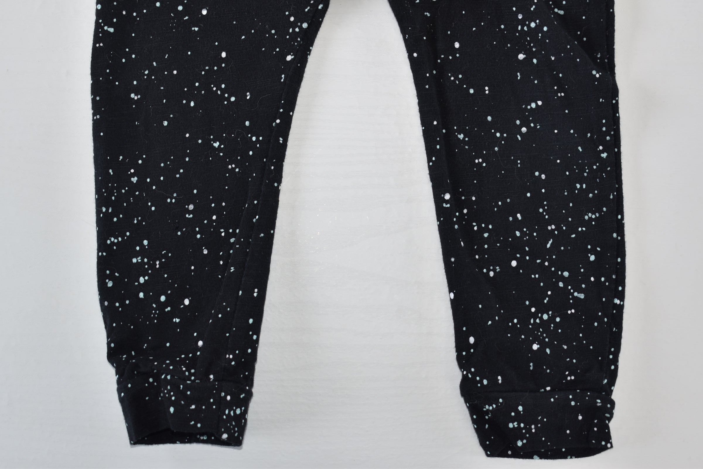 Speckled black trousers
