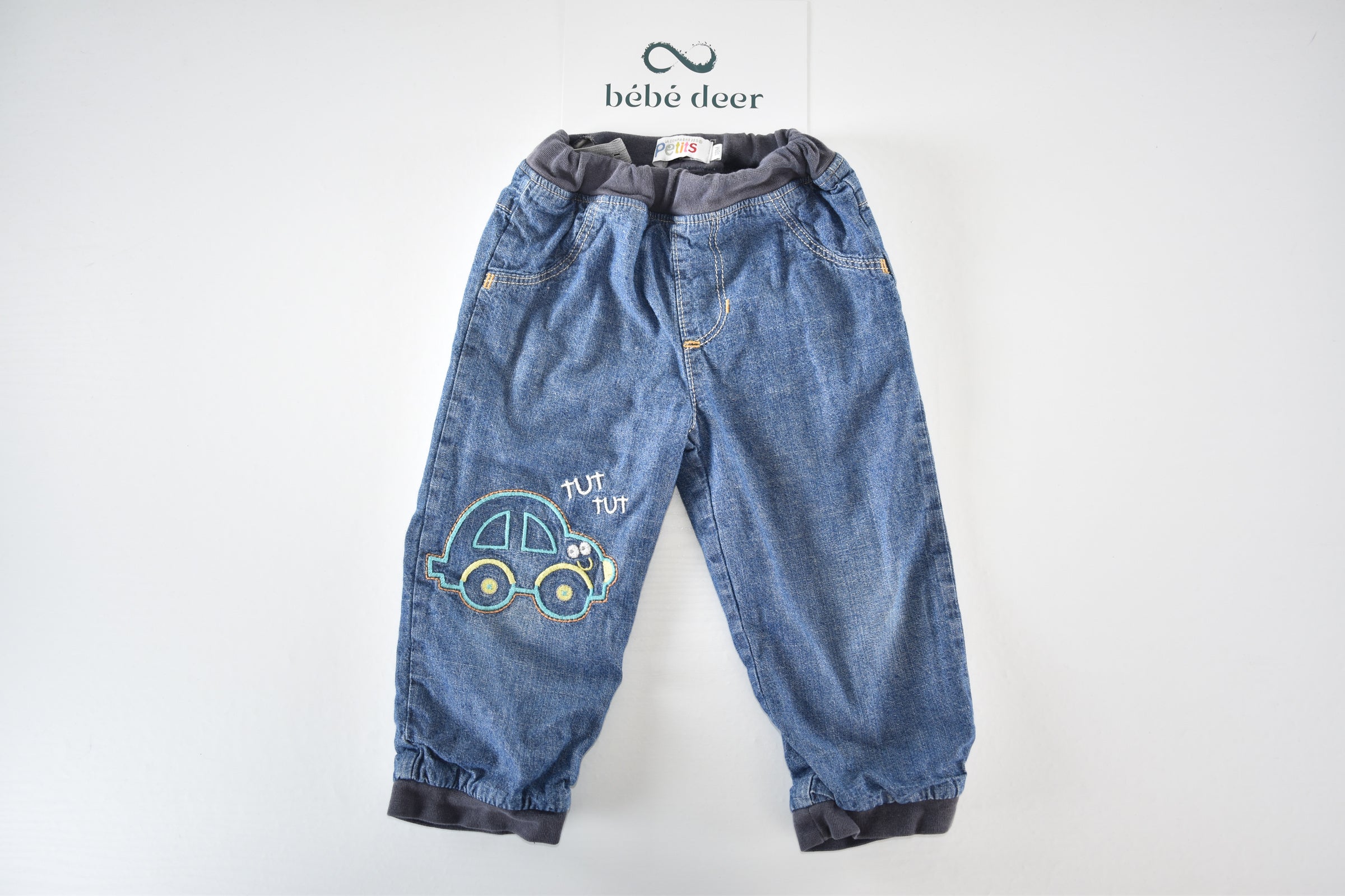 Denim trousers with embroidered car