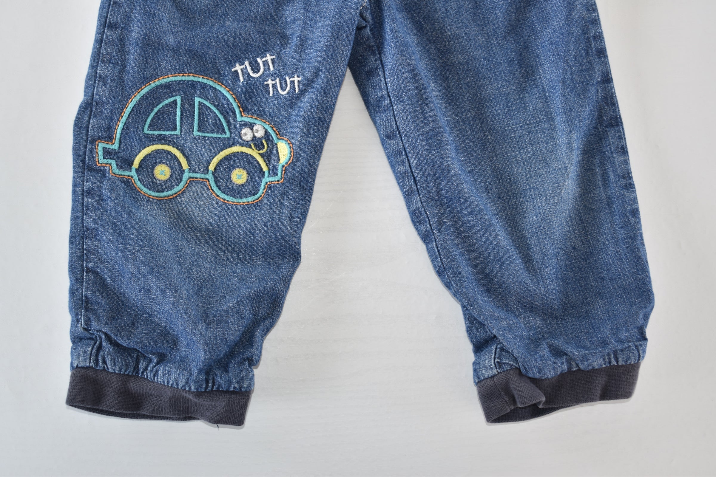 Denim trousers with embroidered car