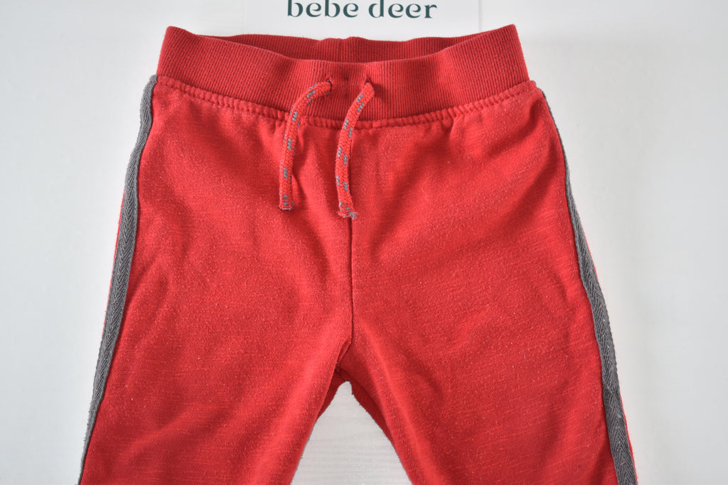 Red trousers with grey side panels