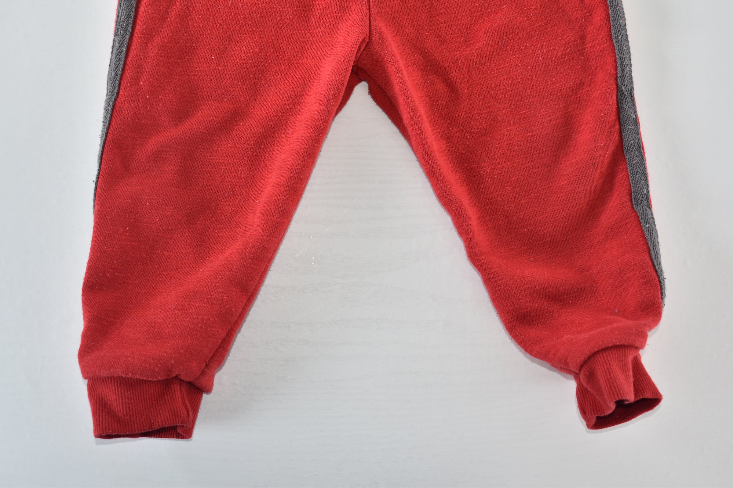 Red trousers with grey side panels