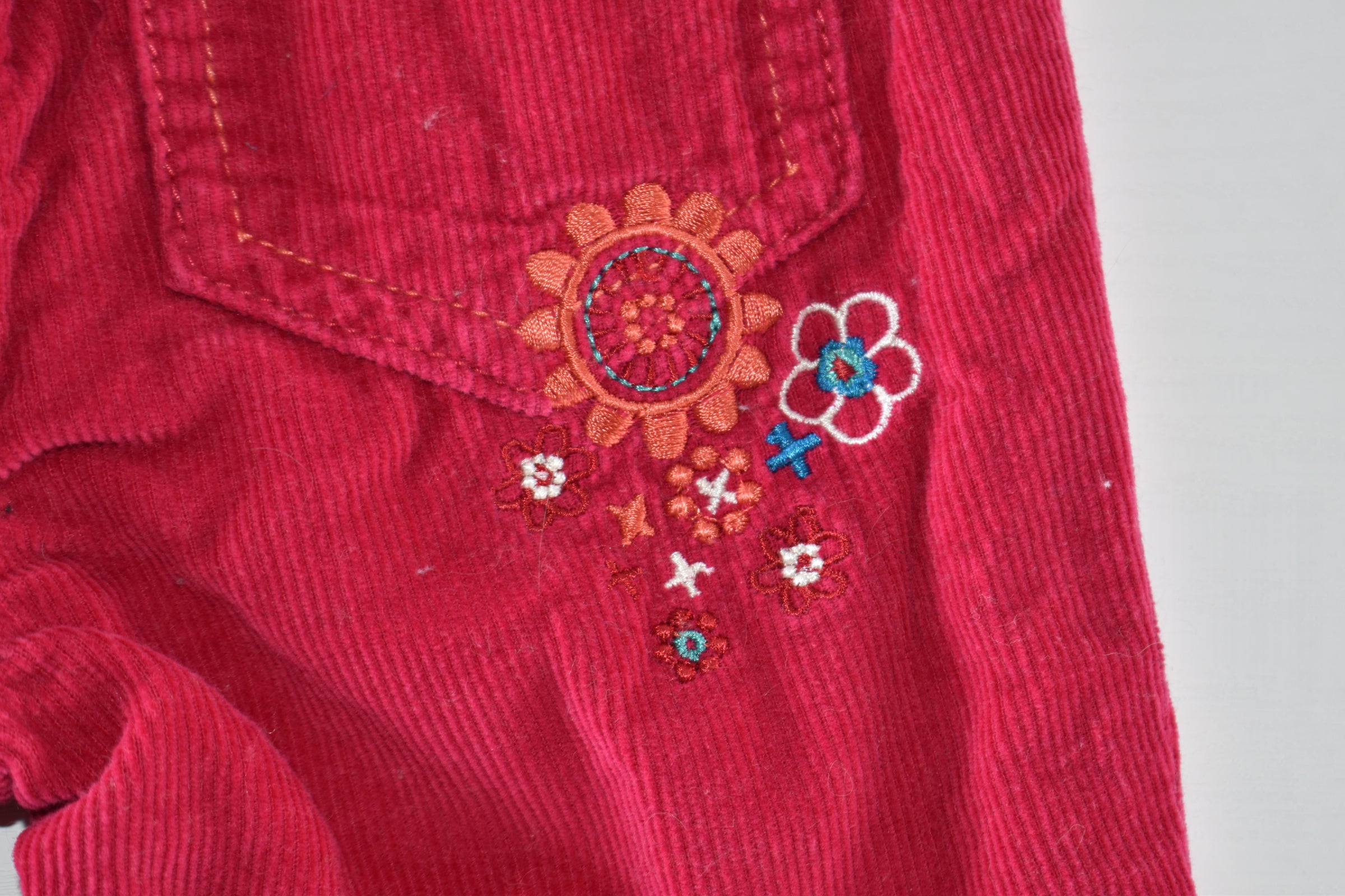 Pink corduroy embroidered trousers