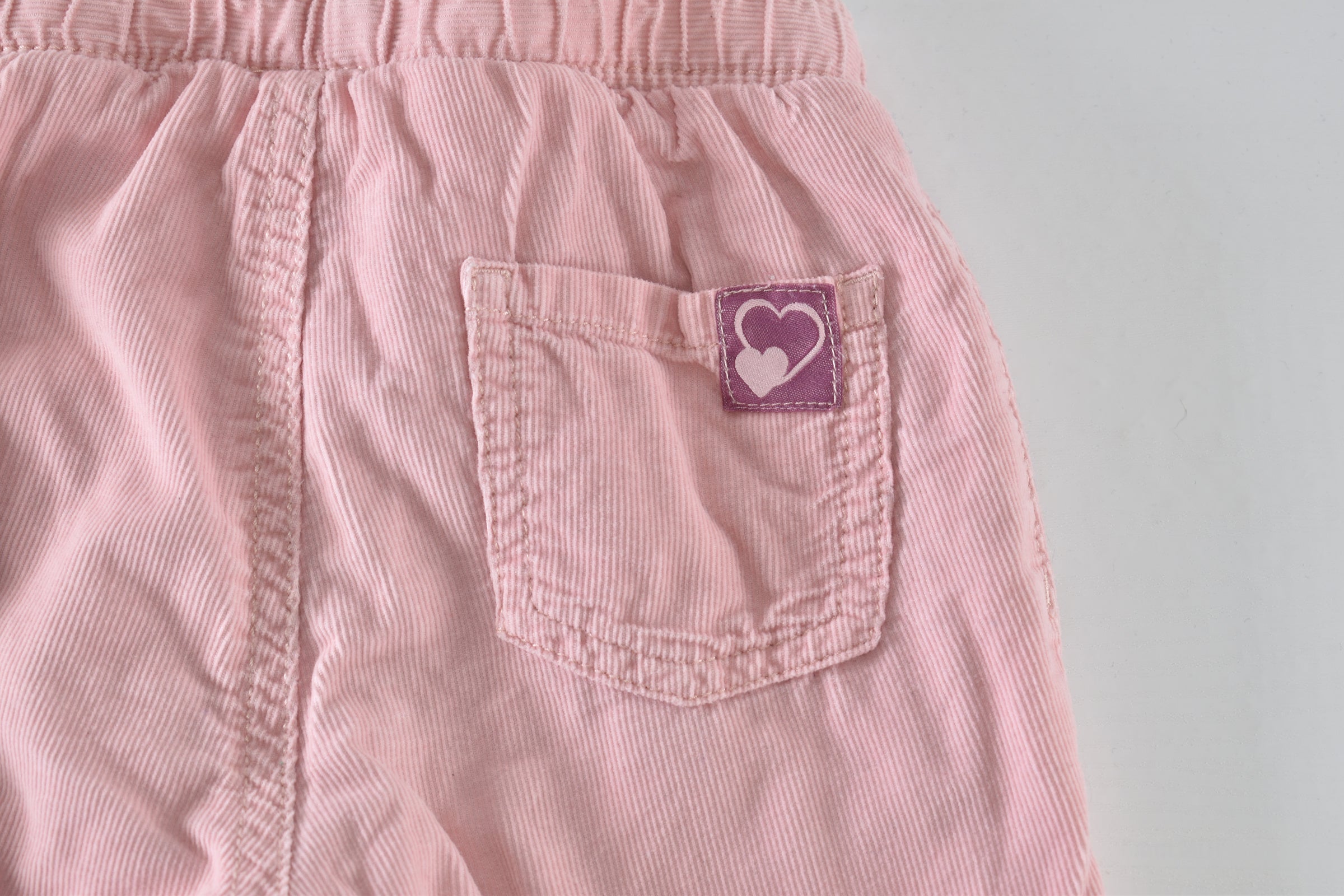 Soft pink lined corduroy trousers