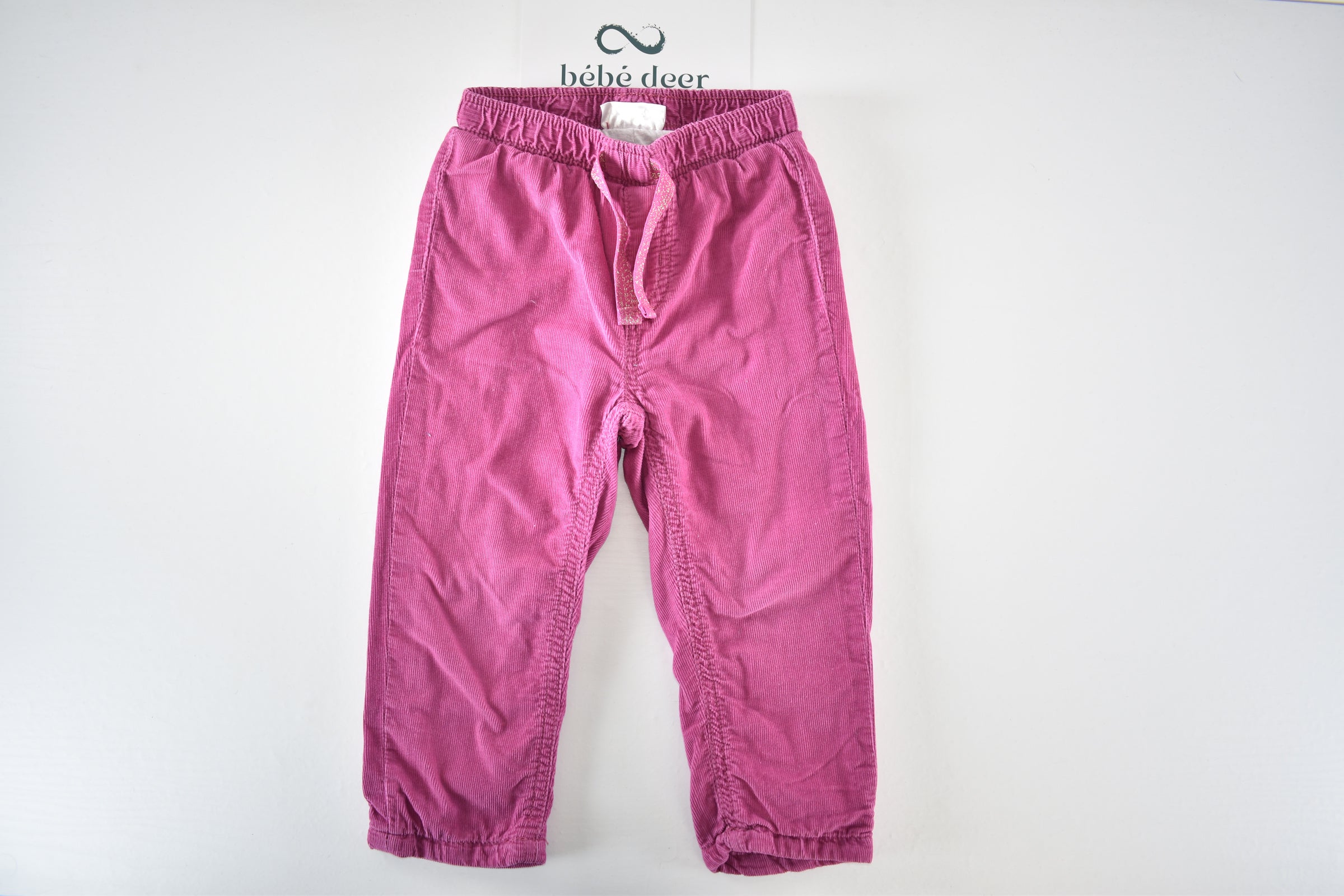 Bright pink lined corduroy trousers