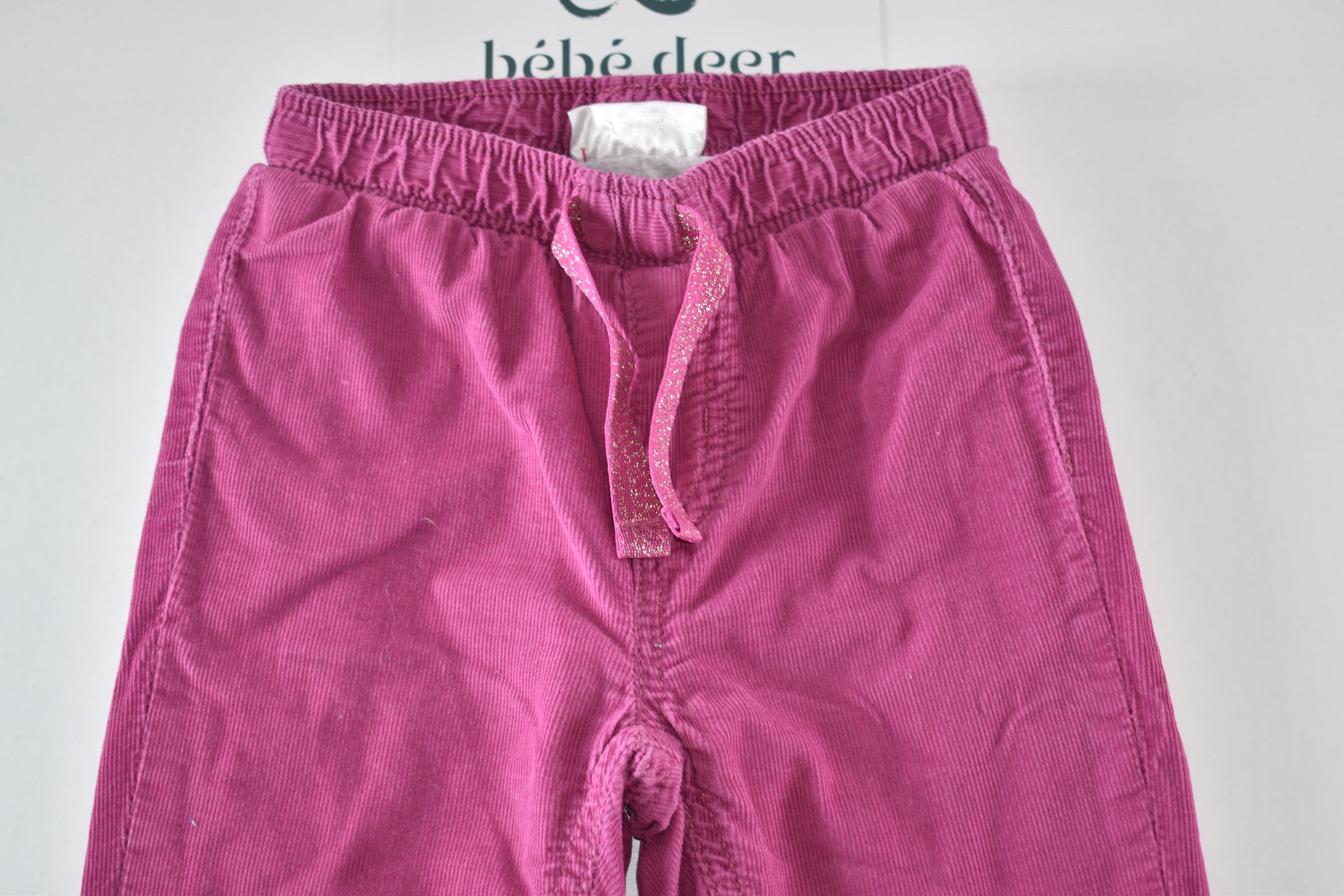 Bright pink lined corduroy trousers