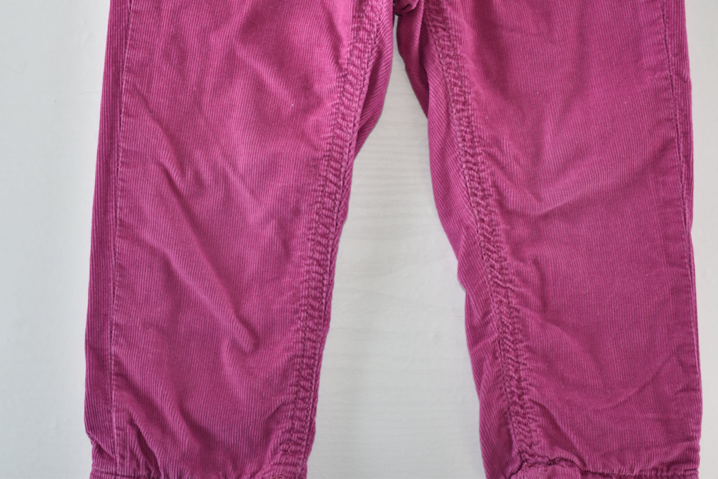 Bright pink lined corduroy trousers