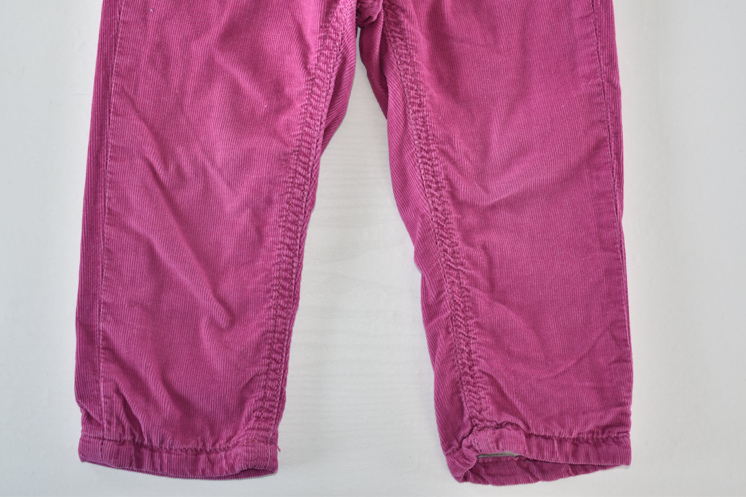 Bright pink lined corduroy trousers