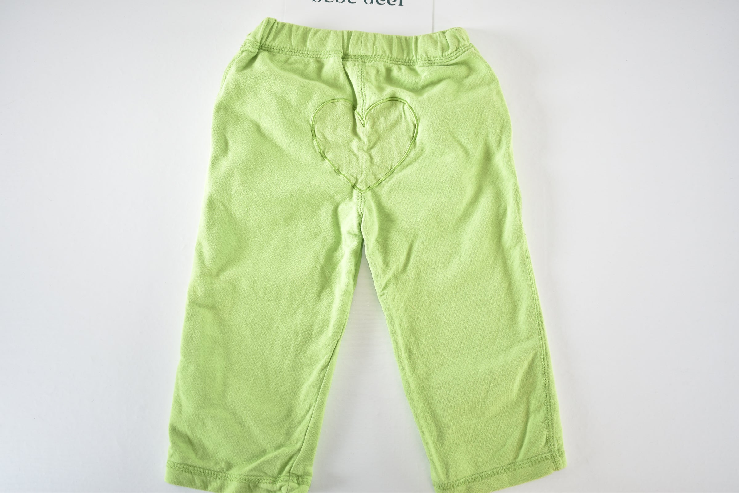 Green trousers with embroidered flowers