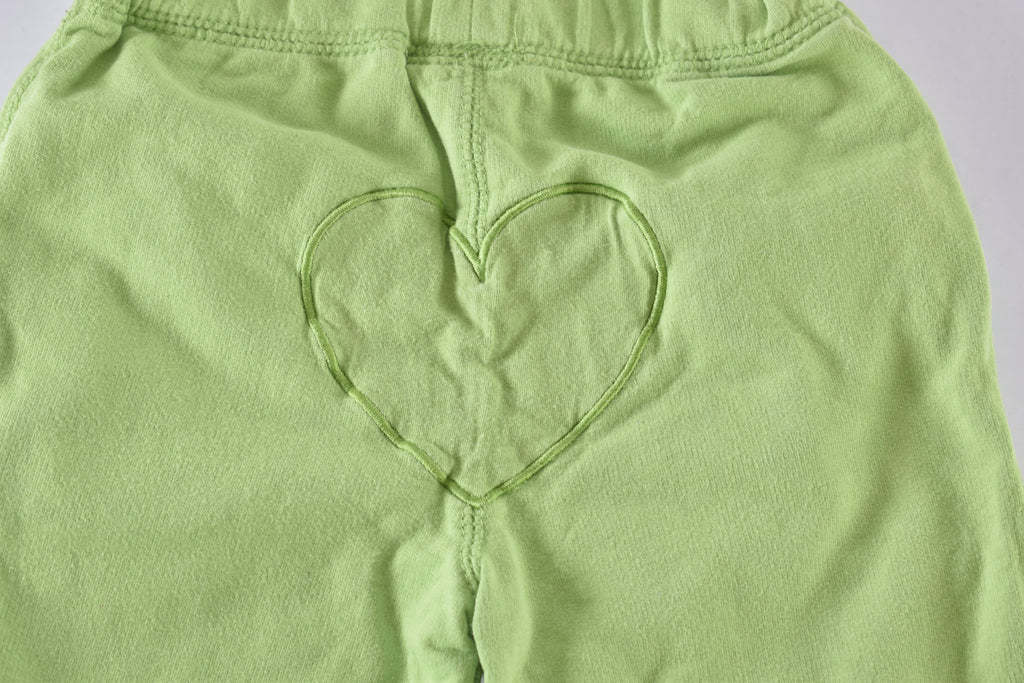 Green trousers with embroidered flowers