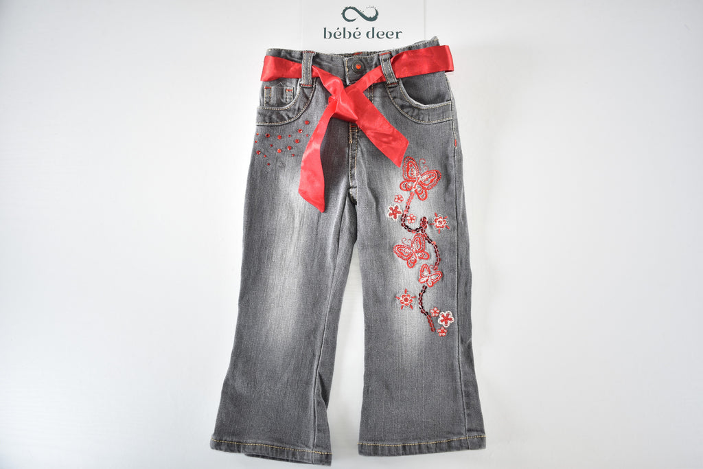 Butterfly embroidered jeans with red belt