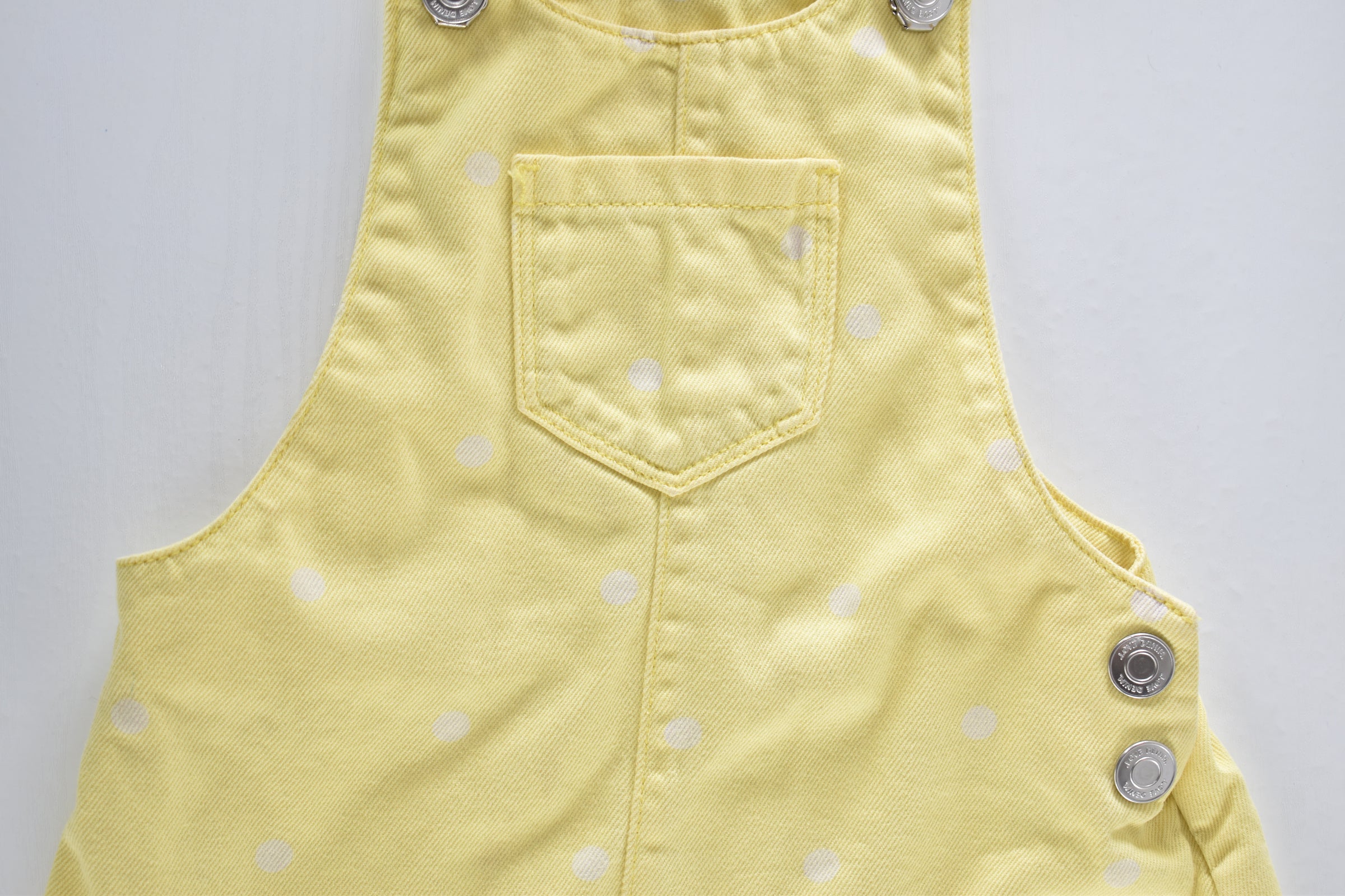Yellow spotted pinafore dress