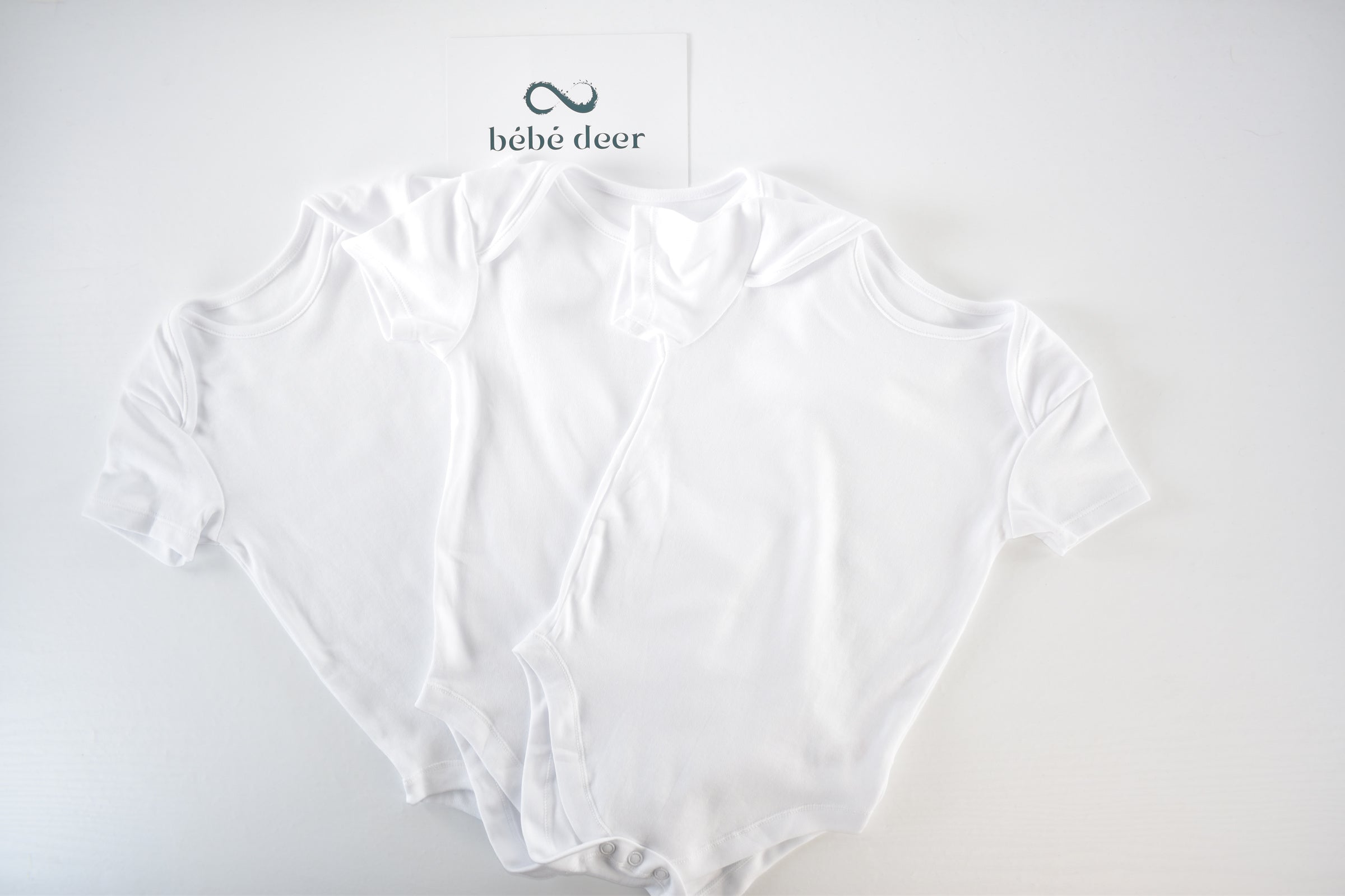 Set of 3 white bodysuits